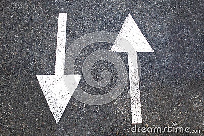 White arrow sign on asphalt road close up. City cycling concept Stock Photo