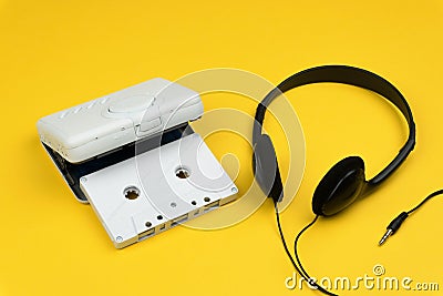 A white audio cassette tape and a white portable cassette player Stock Photo