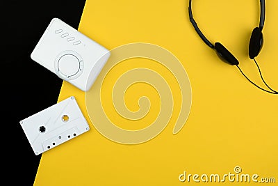 a white audio cassette tape and a white portable cassette player Stock Photo