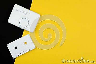 A white audio cassette tape with a white portable cassette player Stock Photo