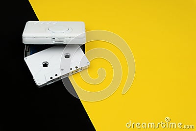 A white audio cassette tape with a white portable cassette player Stock Photo