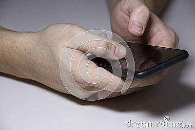 Phone in men`s hands Stock Photo