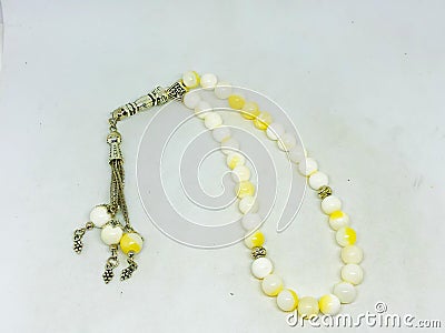 Colorful rosary varieties, white background. Stock Photo