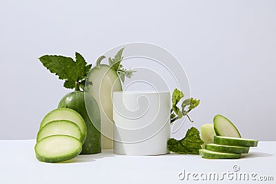 White background featured a cylinder podium white winter melon and green leaves. Stock Photo