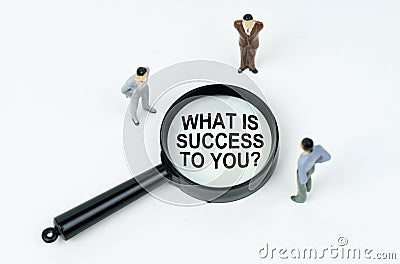 On a white background, figures of businessmen and a magnifying glass with the inscription - WHAT IS SUCCESS TO YOU Stock Photo