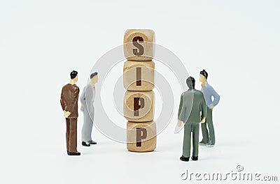 On a white background, figures of businessmen and wooden cubes with the inscription - SIPP Stock Photo