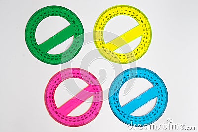 Four colored and round protractors Stock Photo