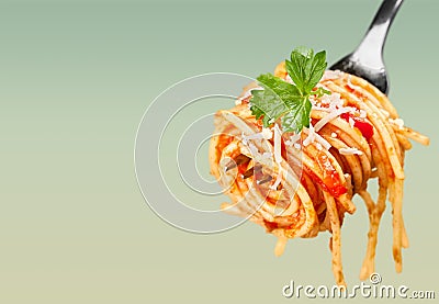 Pasta spaghetti on fork on light background Stock Photo