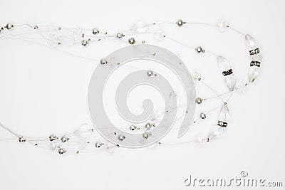 On a white background lies a necklace on the neck with a geme Stock Photo