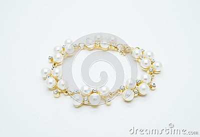 On a white background lies a pearl necklace on the neck and bracelet Stock Photo