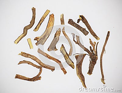 White background Liquorice or licorice or Mulethi is root of glycyrrhiza glabra from a sweet flacour can be extracted. Used in Stock Photo