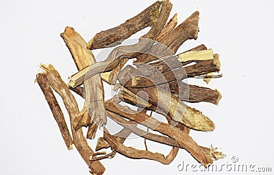 White background Liquorice or licorice or Mulethi is root of glycyrrhiza glabra from a sweet flacour can be extracted. Used in Stock Photo