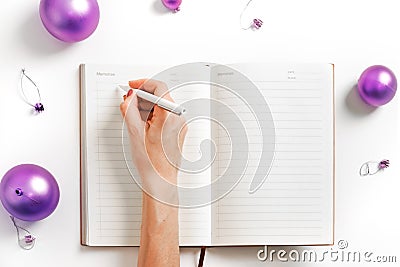 White background notepad hand writing new year resolution violet ball planning life smart goals Stock Photo