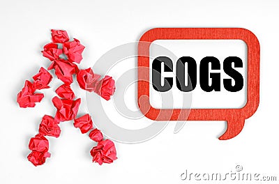 On a white background, a red paper man and a sign with the inscription - COGS Stock Photo