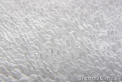 White natural cotton towel background. Texture of white terry towel close-up. White towel macro material. Stock Photo