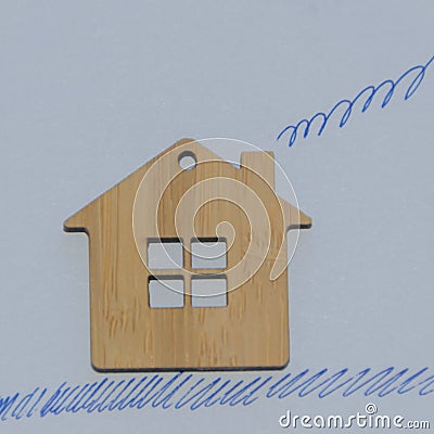 Wooden house with painted grass and smoke from the chimney, on a Stock Photo
