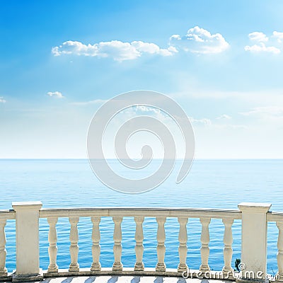 White balcony on sea beach and clouds Stock Photo