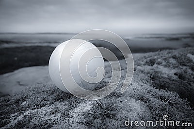 White ball in a landscape Stock Photo