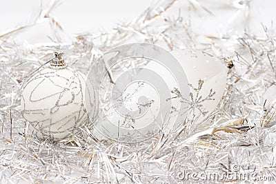 White balls and silver tinsel background Stock Photo