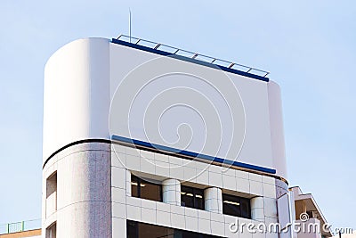 White banner on the facade of the building, Tokyo, Japan. Frame for text. Stock Photo