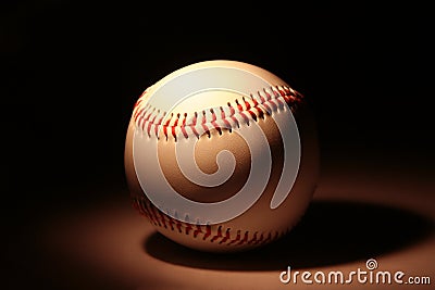 White baseball on dark background Stock Photo