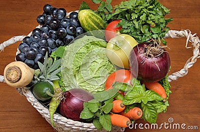 White basket with fresh healthy vegetables and fruit Stock Photo