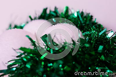 White baubles and green garlandas Stock Photo