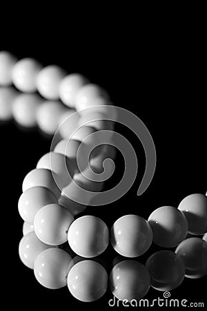 White beads isolated over black Stock Photo