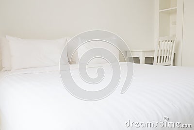 White bed sheets and pillows Stock Photo