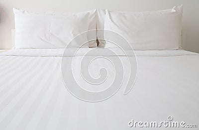 White bed sheets and pillows Stock Photo