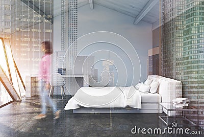 White bedroom in an attic, concrete, girl Stock Photo
