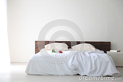 White bedroom bright interiors with bed Stock Photo