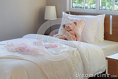 White bedroom decorative with pillows and dolls Stock Photo