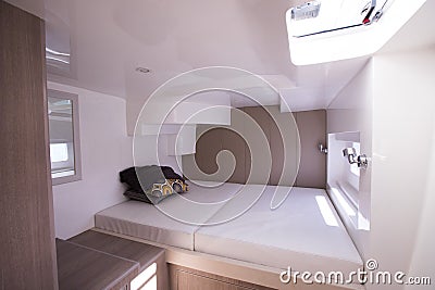 White Bedroom inside Yacht cruise with Windows Stock Photo