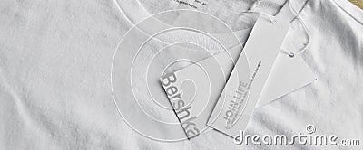 White Bershka L t-shirt and blank label, may 01 2022 Istanbul Maltepe Turkiye Bershka store Editorial Stock Photo