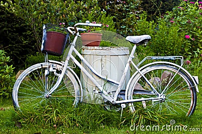 White bicycle or bike as garden decoration Stock Photo