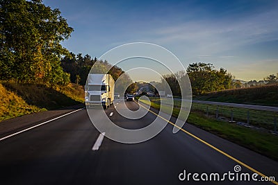 Semi-truck 18 wheeler running on the highway Stock Photo