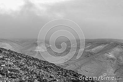 White and black colorful landscape view on judean desert with magic blue sky on background and colorful deep clouds Stock Photo