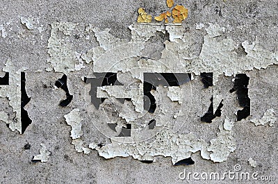 White black grey wall, floor with cracks and remains of pasted paper with unknown text, texture background Stock Photo