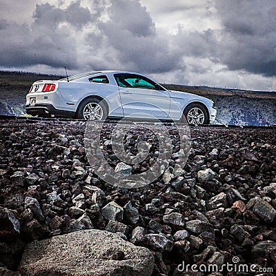 White black mustang lava road asphalt clouds Editorial Stock Photo