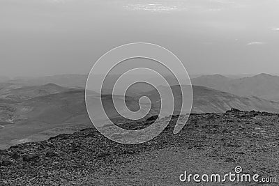 White and black mystic blue morning landscape view on negev judean desert in Israel Stock Photo