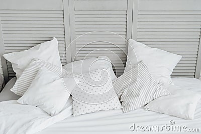 White Blank Pillow on Home Bedroom Headboard Stock Photo