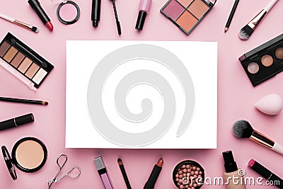 White blank sheet of paper surrounded by luxury decorative cosmetics Stock Photo