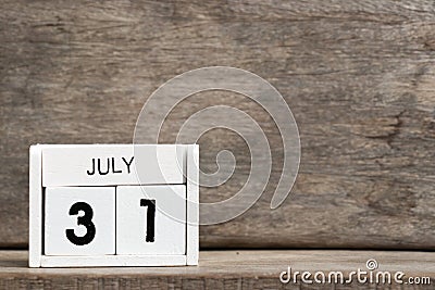 White block calendar present date 31 and month July on wood background Stock Photo