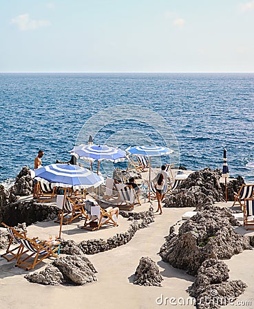 White and blue beach umbrellas in Capri Editorial Stock Photo