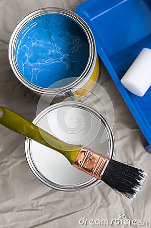 White and blue paint in cans and brush Stock Photo