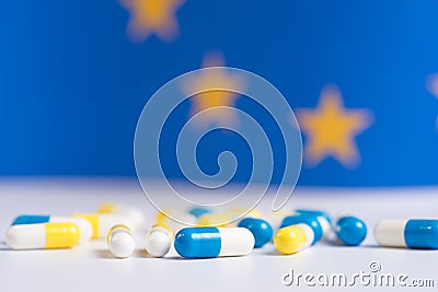White and blue pills on a blue background Stock Photo