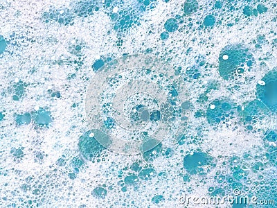 White and blue soap foam. Lather with bubbles. Laundry cleaning or sea wave background Stock Photo