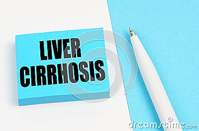 On a white and blue surface, a pen and blue stickers with the inscription - Liver cirrhosis Stock Photo