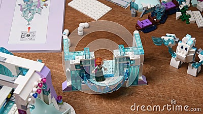 Lego Anna princess stands on balcony of toy castle made from Lego blocks of Frozen Disney cartoon Editorial Stock Photo